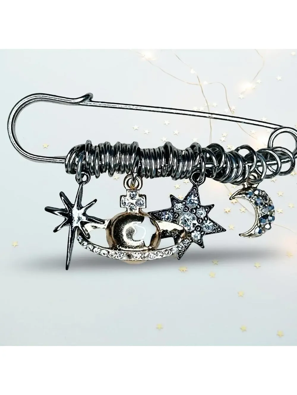244. Silvertone Celestial Charm Brooch